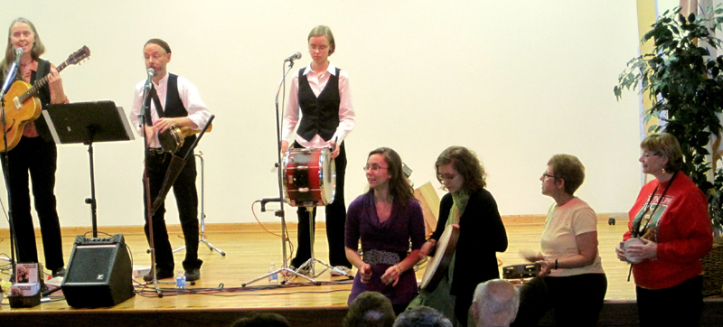 Photo of the Hi-Dukes performing at the Winettka Library with audience drumming along